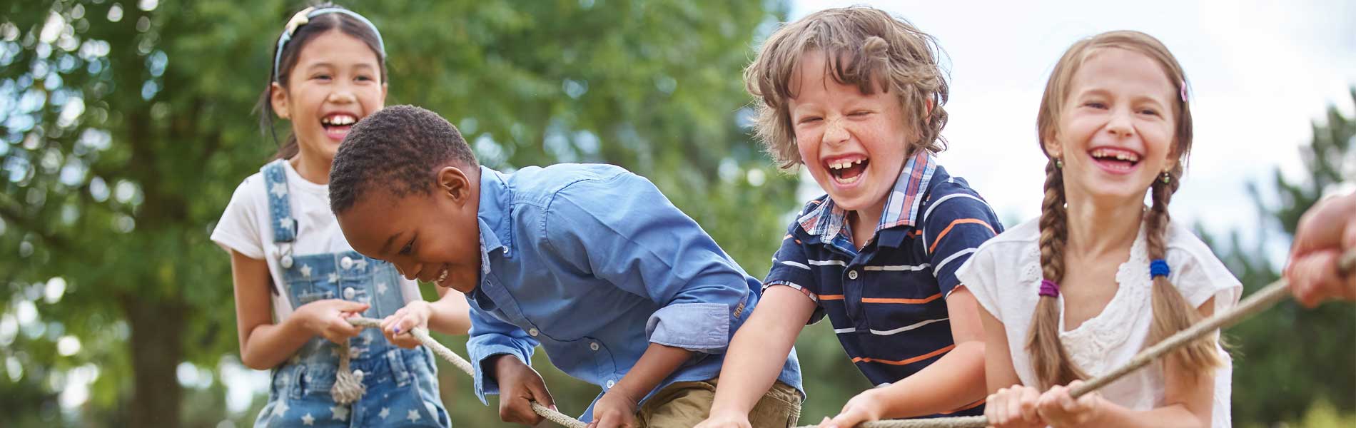 A group of small children laughing and playing