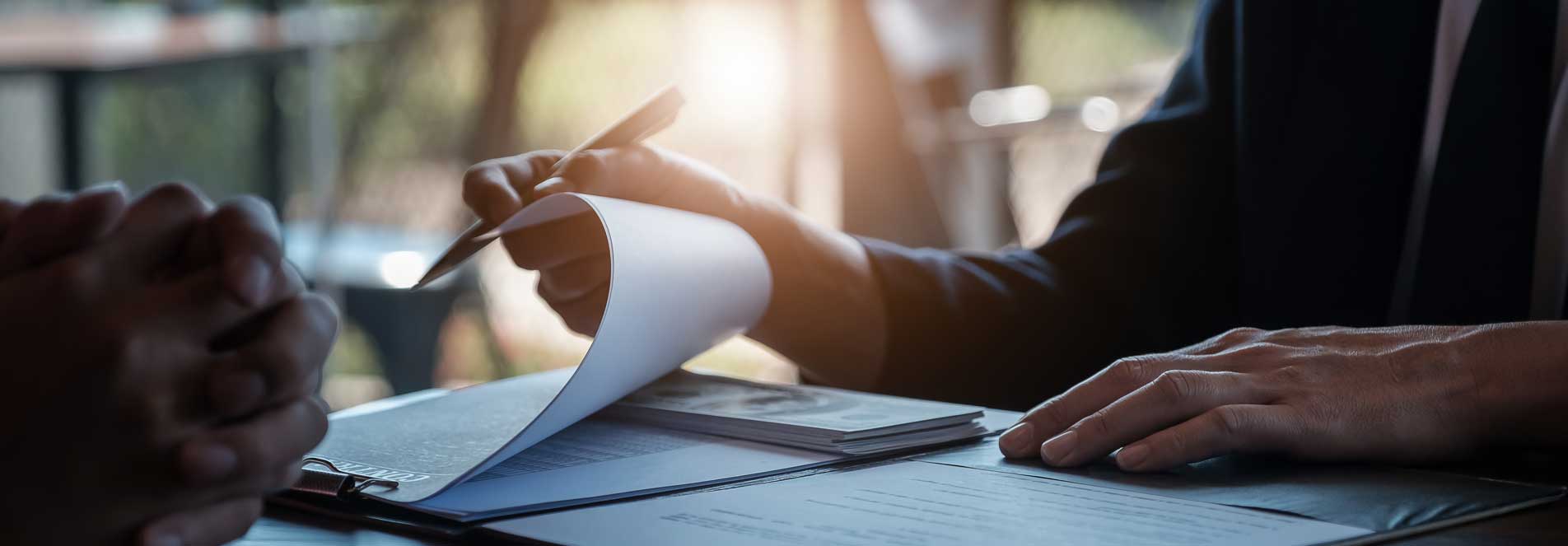 A person looking through a selection of documents